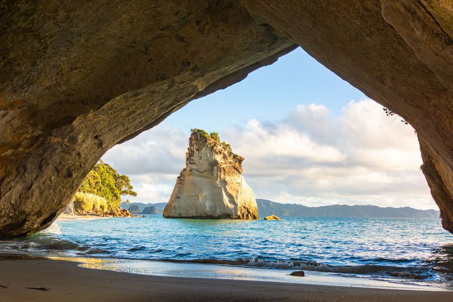 Te Hoho rock framed by the arch at Cathedral Cove